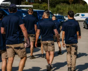 Plumbers walking to their service vans on a Woronora Heights job